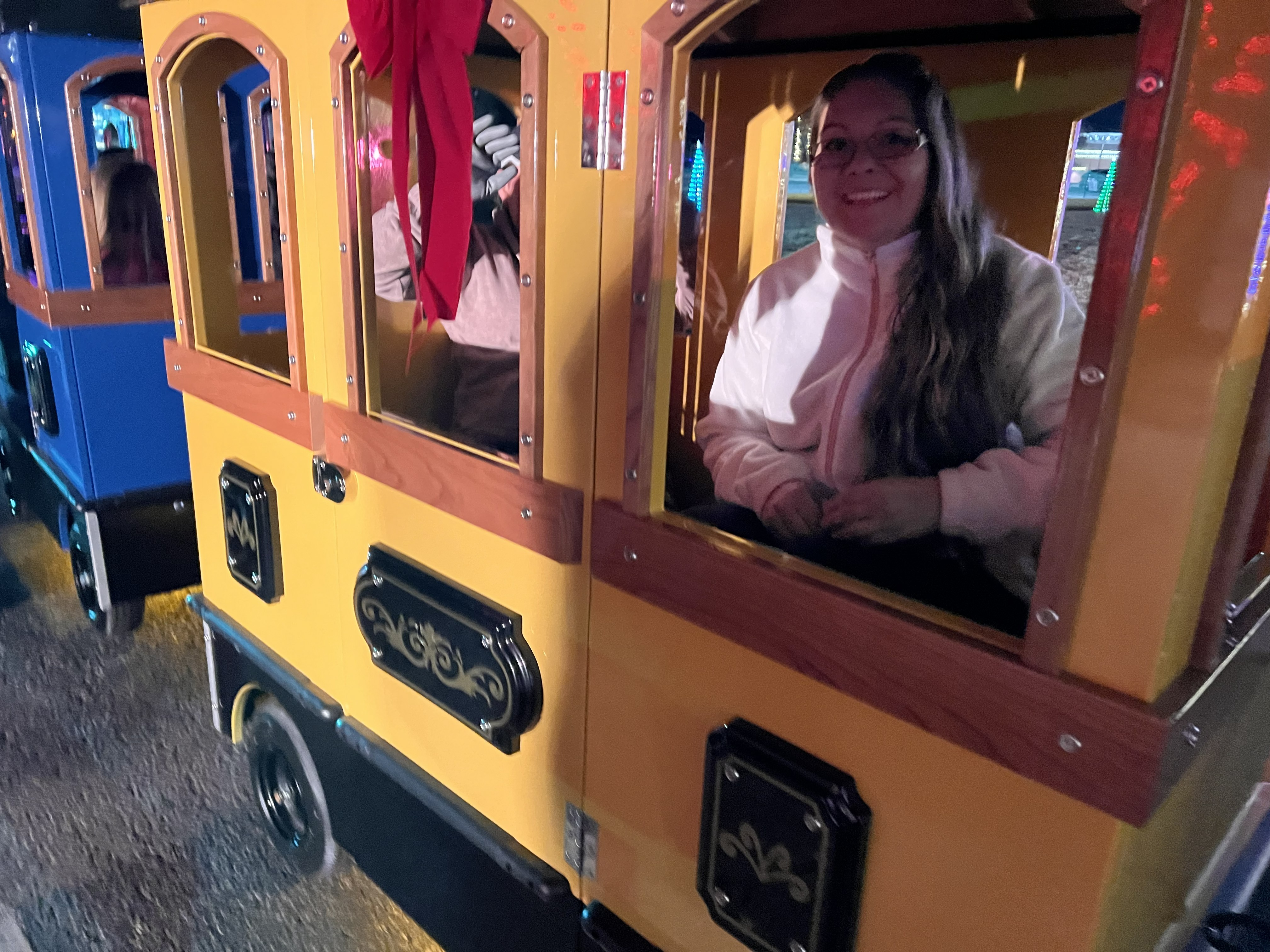 Memphis Deluxe Express electric trackless train illuminated at an evening event
